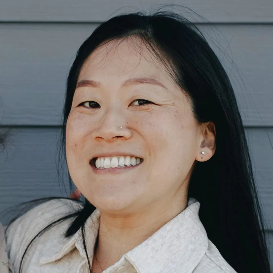 Frontal faces of the three subjects in the photo, so the reader can judge identity