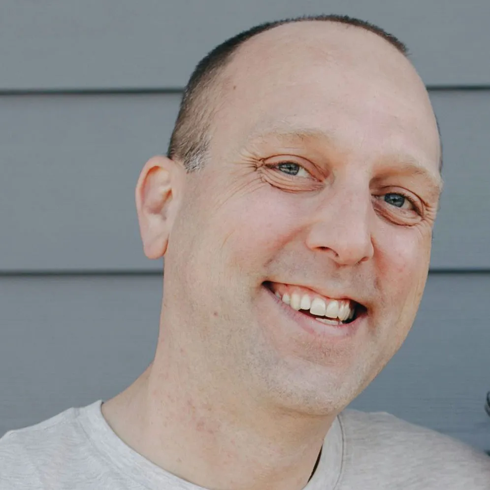 Frontal faces of the three subjects in the photo, so the reader can judge identity