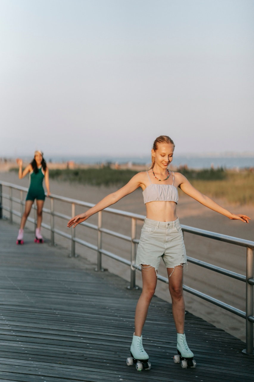 One model skating, the other far in the background